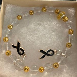 Unisex Bracelet with black ribbons in awareness of melanoma cancer